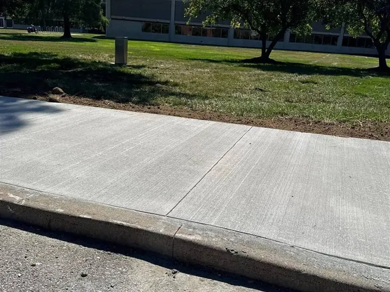 New concrete sidewalk and flatwork poured by MB General Contracting